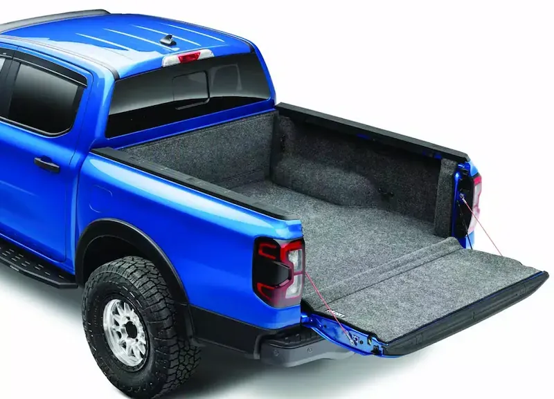 A blue Ford Ranger with a BedRug carpet liner and tailgate mat (BedRug photo)