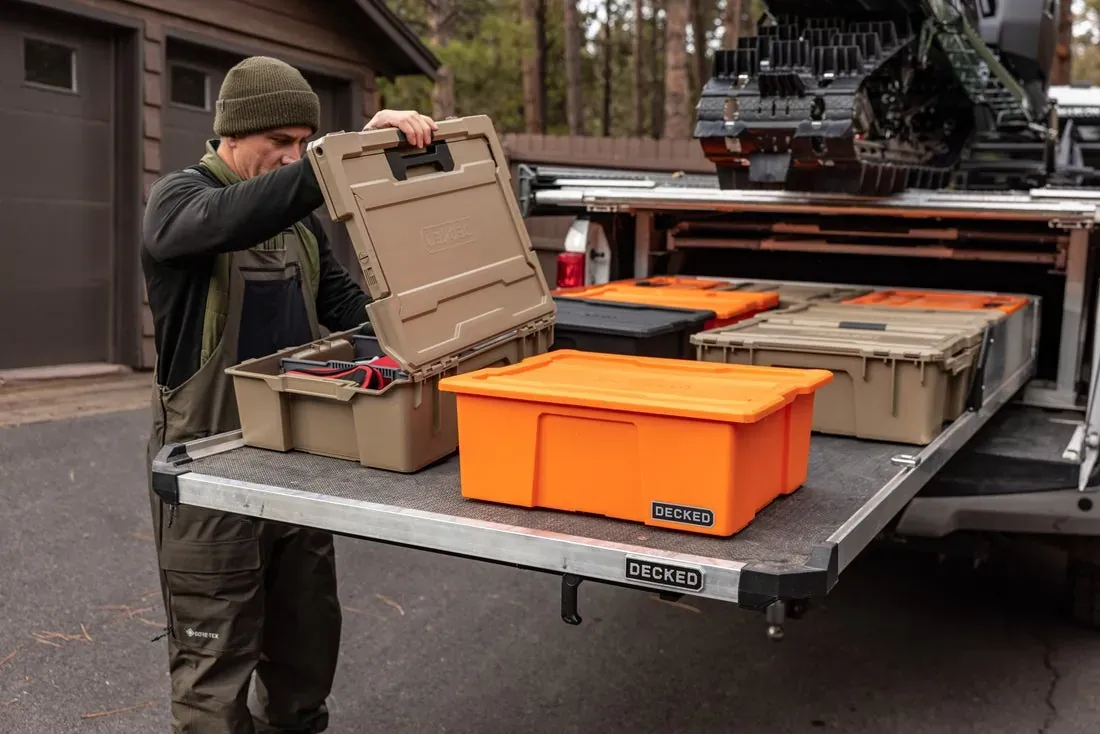 A DECKED CargoGlide slid out of a truck bed with crates on it (DECKED photo)