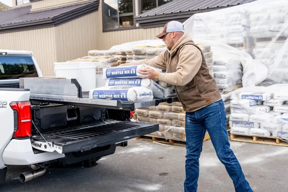 A contractor loading materials onto a DECKED drawer system at a lumber yard (DECKED photo)