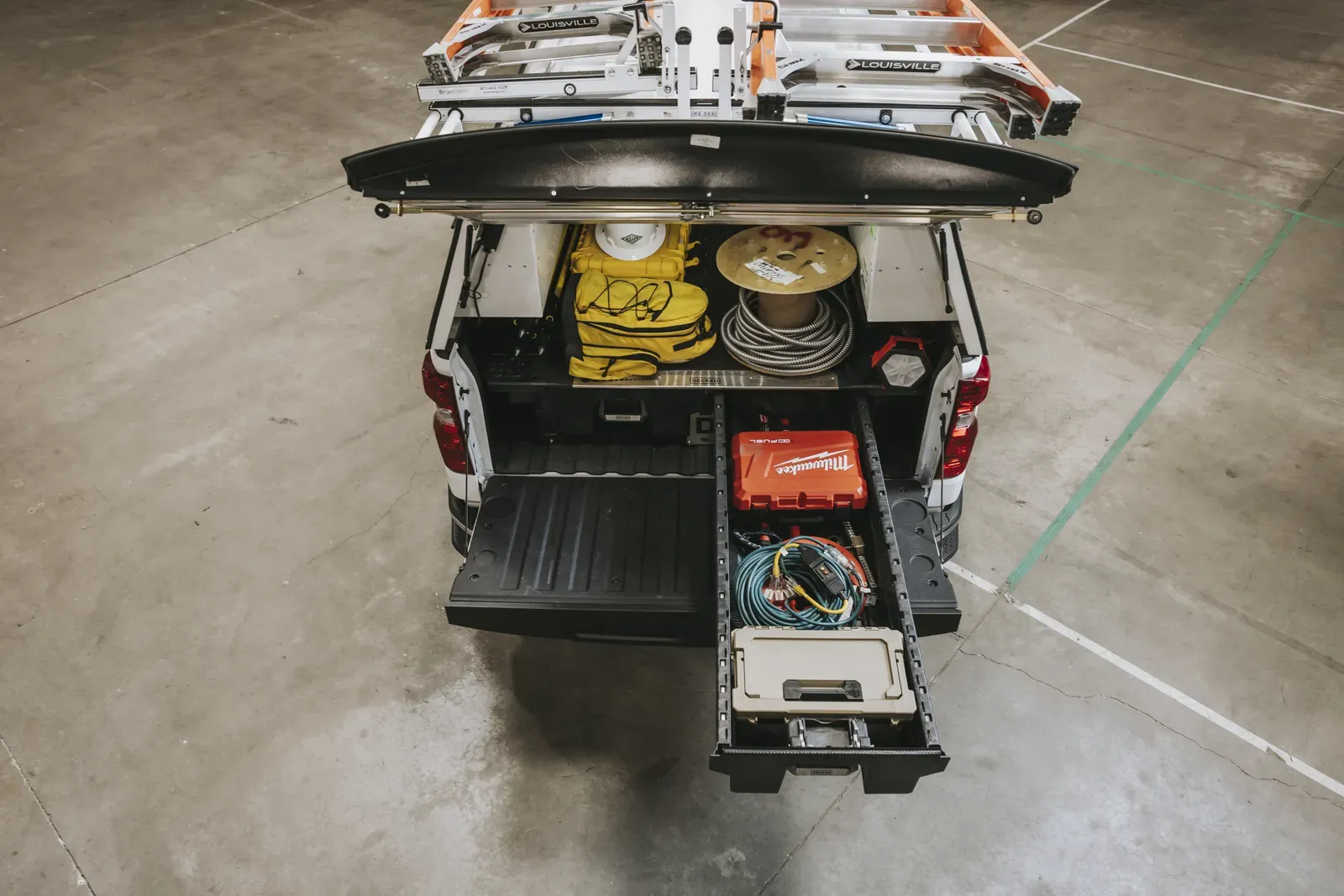 A work truck with both DECKED drawers open, full of welding gear (DECKED photo)