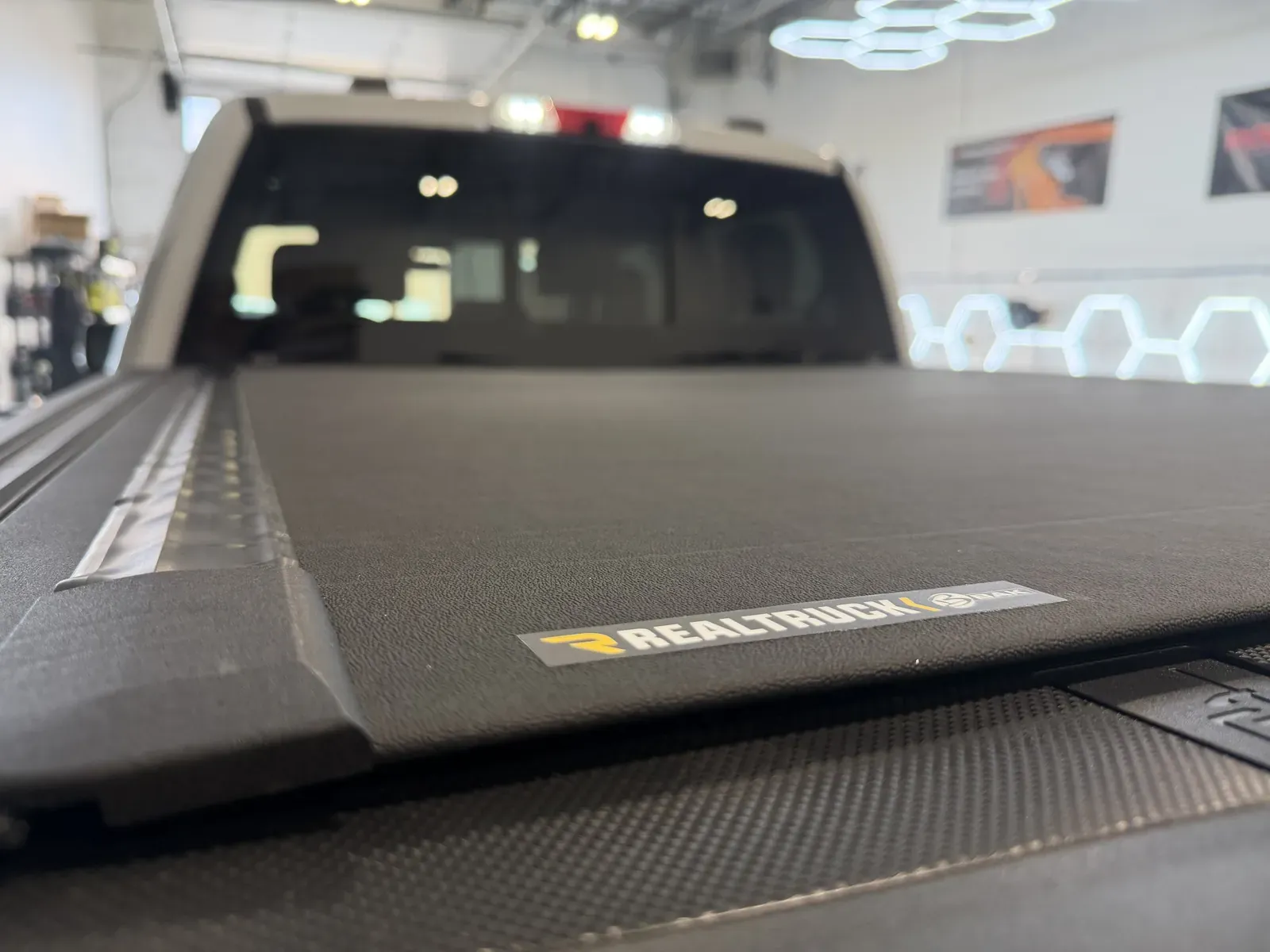 A hard tonneau cover with its RealTruck badge